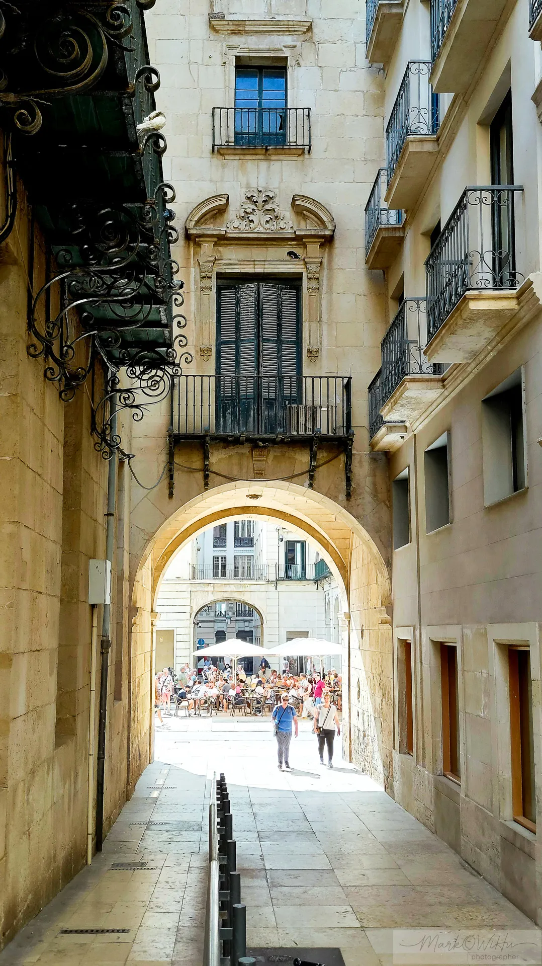 Shaded historic archway opening towards bright sunlight | Foto Walk 2026 Alicante | MarkOWiHu Photographer