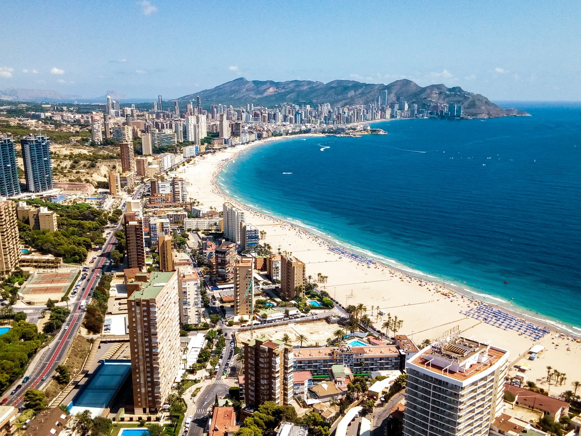 Panoramic high-angle view of beach curve, turquoise sea, and city skyline | Coastal Landscape | Benidorm | MarkOWiHu Photographer Fotógrafo • markowihu.es