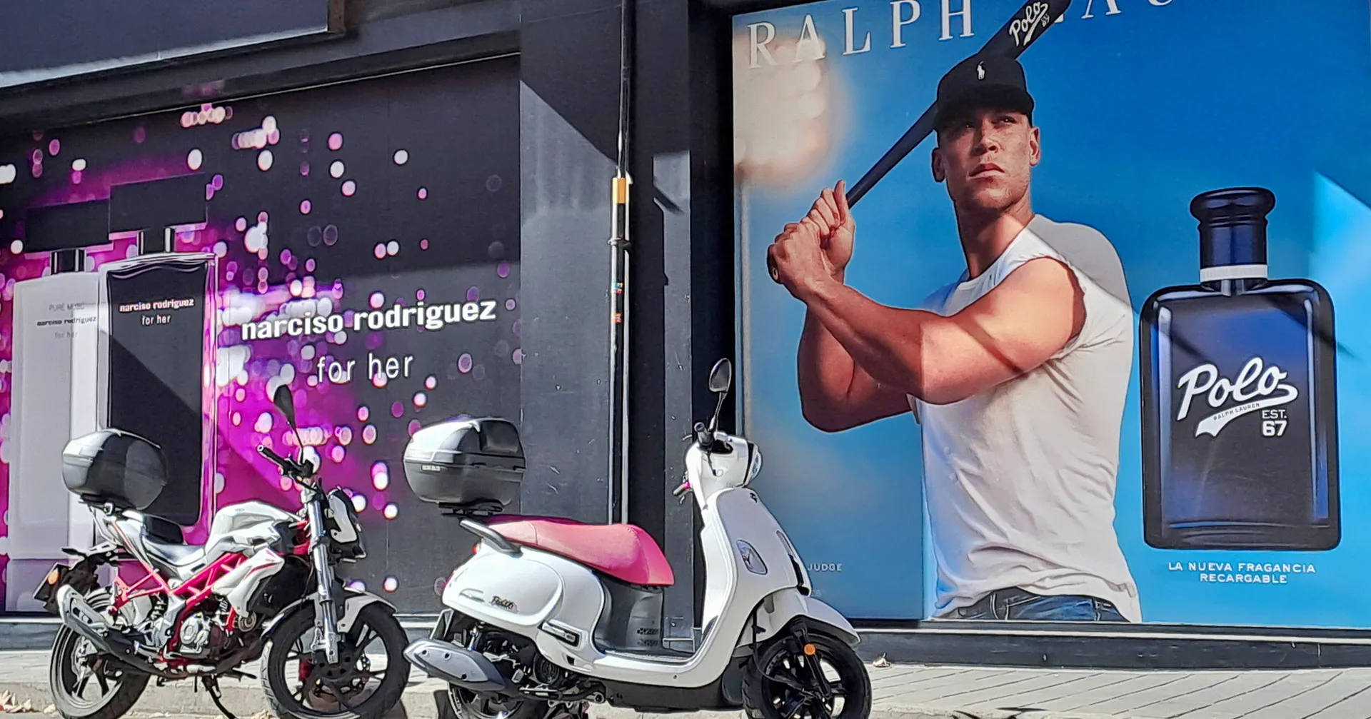 Parked scooters set against massive male perfume billboard advertisement | Street & Humanity | Alicante province | MarkOWiHu Photographer Fotógrafo • markowihu.es